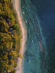 Aerial view of small fishing boats on Balaclava Public Beach at sunset, Mauritius. - AAEF27184