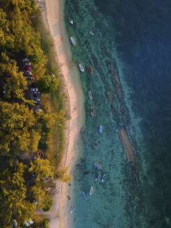 Aerial view of small fishing boats on Balaclava Public Beach at sunset, Mauritius. - AAEF27184