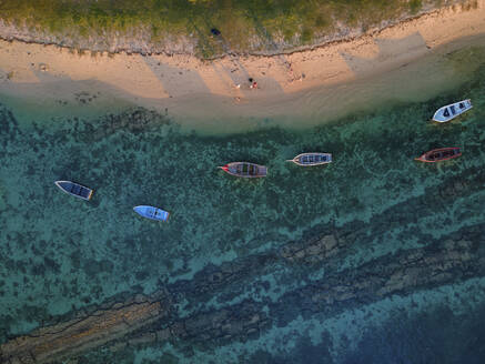 Aerial view of small fishing boats on Balaclava Public Beach at sunset, Mauritius. - AAEF27185
