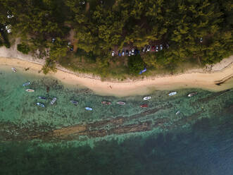 Aerial view of small fishing boats on Balaclava Public Beach at sunset, Mauritius. - AAEF27187