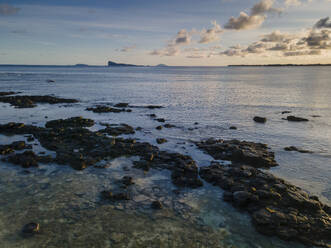 Aerial view of clear reef at sunrise with Gunner's Quoin island in the background, Pointe aux Canonniers coastline, Grand Baie, Mauritius. - AAEF27189