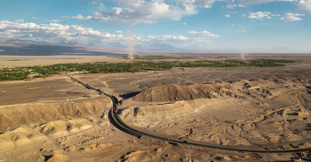 Aerial drone view of the city of San Pedro De Atacama with two sand tornados, Desert of atacama, Chile. - AAEF27222