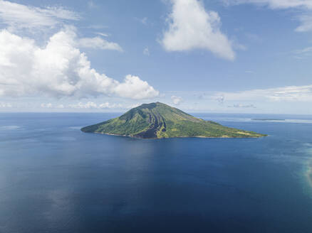 Aerial View of Ruang Volcano crater next to Tulandang Island, Indonesia. - AAEF27236