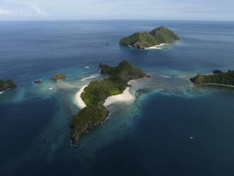 Aerial View of small uninhabited Masare and Mahoro Islands with pristine beaches next to Siau in Sitaro, Indonesia. - AAEF27238