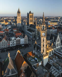 Aerial view of Sint Niklaaskerk (Saint Nicholas' Church) and the Gildenhuis van de Vrije Schippers clock tower in Gent downtown, Ghent, East Flanders, Belgium. - AAEF27252