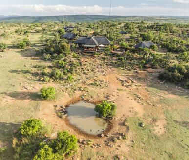 Aerial view of touristic houses with a small pond in the Savanna near Lephalale town, Limpopo region, South Africa. - AAEF27254