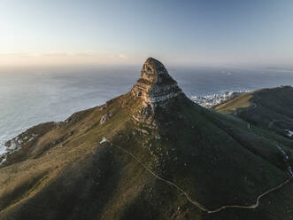 Aerial view of Signal Hill Nature Reserve (Lion's Rump), a landmark flat topped hill along the Atlantic Ocean coastline, Cape Town, Western Cape, South Africa. - AAEF27291