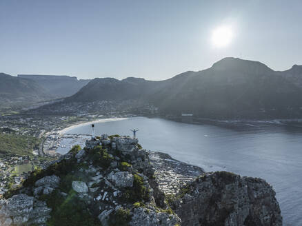Aerial view of a person on Sentinel Peak along the Hout Bay, Cape Town, Western Cape, South Africa. - AAEF27305