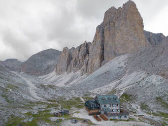 Aerial view of Antermoia Refuge on Dolomites near the lake Antermoia. Catinaccio Group, Italy. - AAEF27428