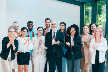 Businessmen and businesswomen making a corporate party after the business conference to celebrate the year goals and achievements. - DMDF10513