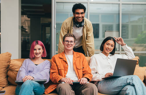 Cinematic image of a programming office with young programmers working on a new project for a start up business. - DMDF10824