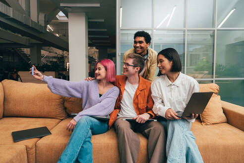 Cinematic image of a programming office with young programmers working on a new project for a start up business. - DMDF10825