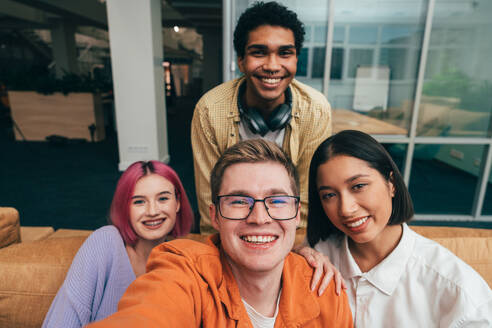 Cinematic image of a programming office with young programmers working on a new project for a start up business. - DMDF10826