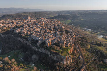 Aerial view of Orvieto at sunset, a small town perched on the rock cliff in Umbria, Terni, Italy. - AAEF27560