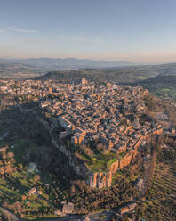Panoramic aerial view of Orvieto at sunset, a small town perched on the rock cliff in Umbria, Terni, Italy. - AAEF27561