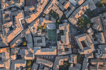 Aerial view of a soccer field among the houses in Orvieto, a small town in Umbria, Terni, Italy. - AAEF27566