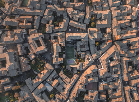 Aerial view of a soccer field among the houses in Orvieto, a small town in Umbria, Terni, Italy. - AAEF27572