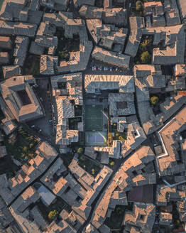Aerial view of a soccer field among the houses in Orvieto, a small town in Umbria, Terni, Italy. - AAEF27573