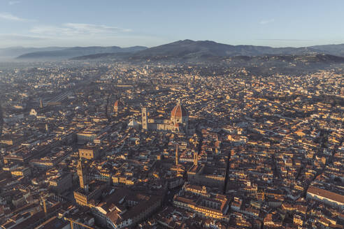 Aerial view of Cathedral of Santa Maria del Fiore, a gothic style church in Florence downtown at sunset, Florence, Tuscany, Italy. - AAEF27585