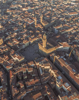 Aerial view of Piazza della Signoria, a famous landmark square in front of Palazzo Vecchio in Florence downtown at sunset, Florence, Tuscany, Italy. - AAEF27590