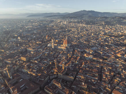 Aerial view of Cathedral of Santa Maria del Fiore, a gothic style church in Florence downtown at sunset, Florence, Tuscany, Italy. - AAEF27593