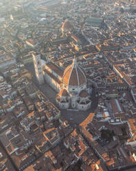Aerial view of Cathedral of Santa Maria del Fiore, a gothic style church in Florence downtown at sunset, Florence, Tuscany, Italy. - AAEF27596