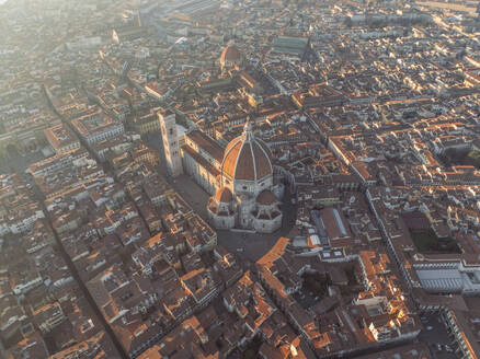 Aerial view of Cathedral of Santa Maria del Fiore, a gothic style church in Florence downtown at sunset, Florence, Tuscany, Italy. - AAEF27597