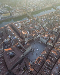 Aerial view of Piazza della Signoria along the Arno river in Florence downtown at sunset, Florence, Tuscany, Italy. - AAEF27609