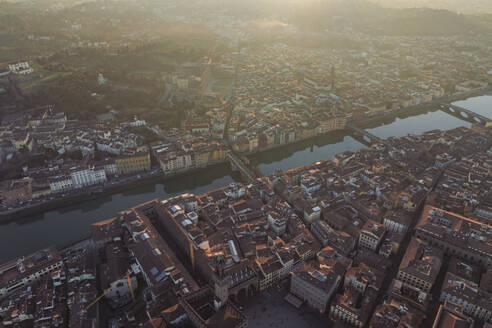 Aerial view of Florence downtown along the Arno river at sunset, Florence, Tuscany, Italy. - AAEF27610