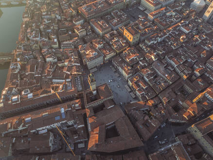 Aerial view of Piazza della Signoria along the Arno river in Florence downtown at sunset, Florence, Tuscany, Italy. - AAEF27613