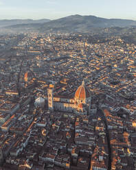 Aerial view of Cathedral of Santa Maria del Fiore, a gothic style church in Florence downtown at sunset, Florence, Tuscany, Italy. - AAEF27614