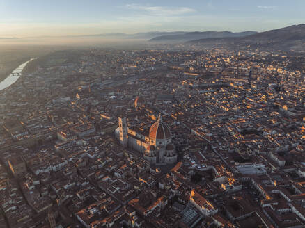 Aerial view of Cathedral of Santa Maria del Fiore, a gothic style church in Florence downtown at sunset, Florence, Tuscany, Italy. - AAEF27615