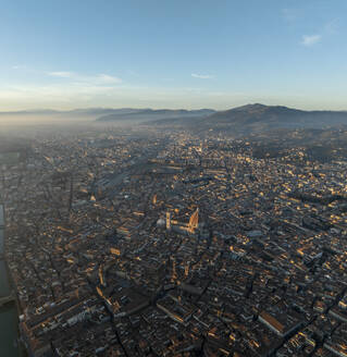 Aerial view of Cathedral of Santa Maria del Fiore, a gothic style church in Florence downtown at sunset, Florence, Tuscany, Italy. - AAEF27617