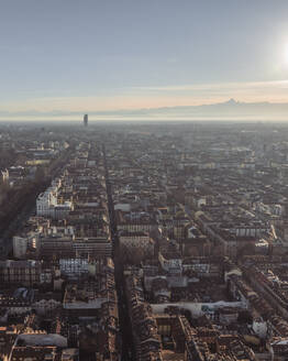 Aerial view of Turin downtown in evening haze at sunset with the Alps mountain range in background, Turin, Piedmont, Italy. - AAEF27622
