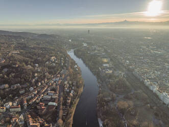 Aerial view of the Po river crossing Turin downtown at sunset, Turin, Piedmont, Italy. - AAEF27652