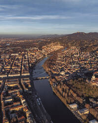 Aerial view of the Po river crossing Turin downtown at sunset, Turin, Piedmont, Italy. - AAEF27663