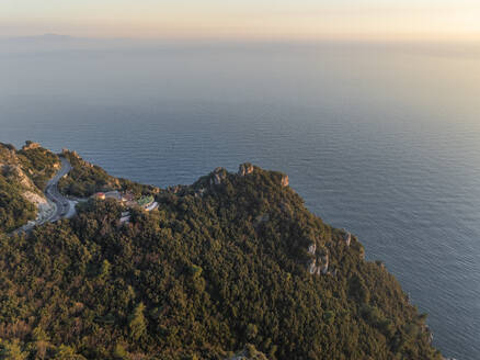 Aerial view of Capo d'Orso promontory along the Amalfi Coast drive with high cliffs facing the Mediterranean Sea at sunset, Amalfi, Salerno, Campania, Italy. - AAEF27666