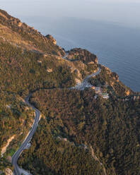 Aerial view of the scenic road along the Amalfi Coast facing the Mediterranean Sea at sunset, Amalfi, Salerno, Campania, Italy. - AAEF27674