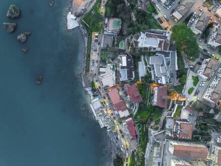 Aerial view of Vietri sul Mare along the Amalfi Coast facing the Mediterranean Sea at sunset, Salerno, Campania, Italy. - AAEF27679