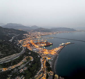 Aerial view of Salerno harbour and commercial port at sunset along the Amalfi Coast facing the Mediterranean Sea, Salerno, Campania, Italy. - AAEF27683