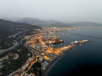 Aerial view of Salerno harbour and commercial port at sunset along the Amalfi Coast facing the Mediterranean Sea, Salerno, Campania, Italy. - AAEF27684