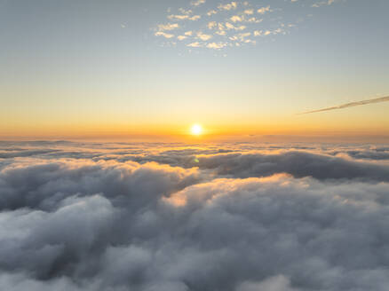 Aerial view of a beautiful sunset as seen from the plane, view above the clouds, Amalfi Coast, Salerno, Campania, Italy. - AAEF27710