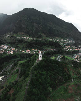 Aerial drone view of Capelinha de Nossa Senhora de Fatima white church, Sao Vicente, Madeira island, Portugal. - AAEF27733