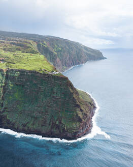 Aerial drone view of Madeira coastline, lighthouse and cliffs from Ponta do Pargo, furthest south end of Madeira island, Portugal. - AAEF27742