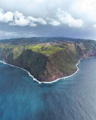 Aerial drone view of Madeira coastline, lighthouse and cliffs from Ponta do Pargo, furthest south end of Madeira island, Portugal. - AAEF27744