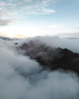 View of mountain peaks and low hanging clouds during sunrise, near Pico de Areeiro, Madeira Island, Portugal. - AAEF27745