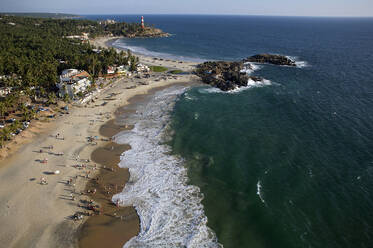 Aerial view of Kovalam beach village on the sandy coast of Kerala, India. - AAEF27751