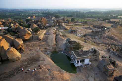 Aerial view of ancient Hemakutta hill with ruins of Hampi in sunset, Karnataka, India. - AAEF27758