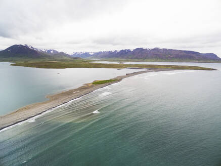 Aerial view of coast with sea, lagoon Miklavatn and mountains in Skagafjordur, Nordurland vestra, Iceland. - AAEF27815