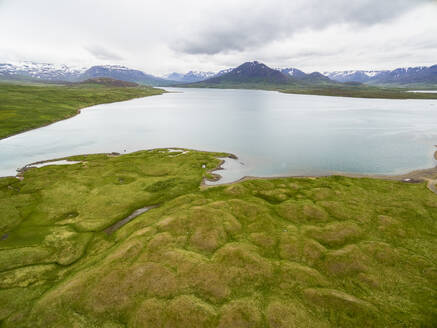 Aerial view of lake Miklavatn in front of mountains, Skagafjordur, Nordurland vestra, Iceland. - AAEF27819